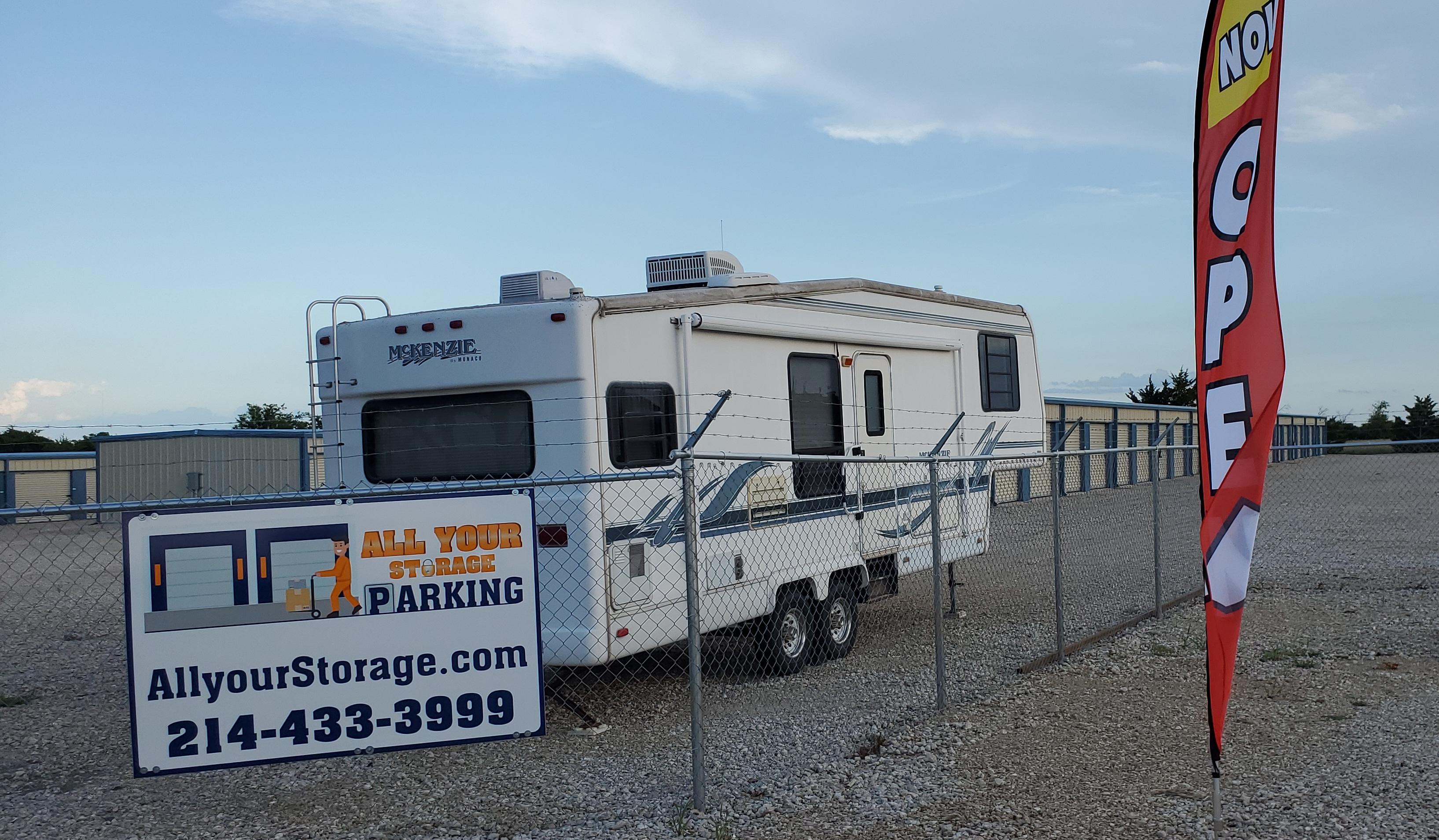 A photograph of the facility, the storage units, and parking spaces.